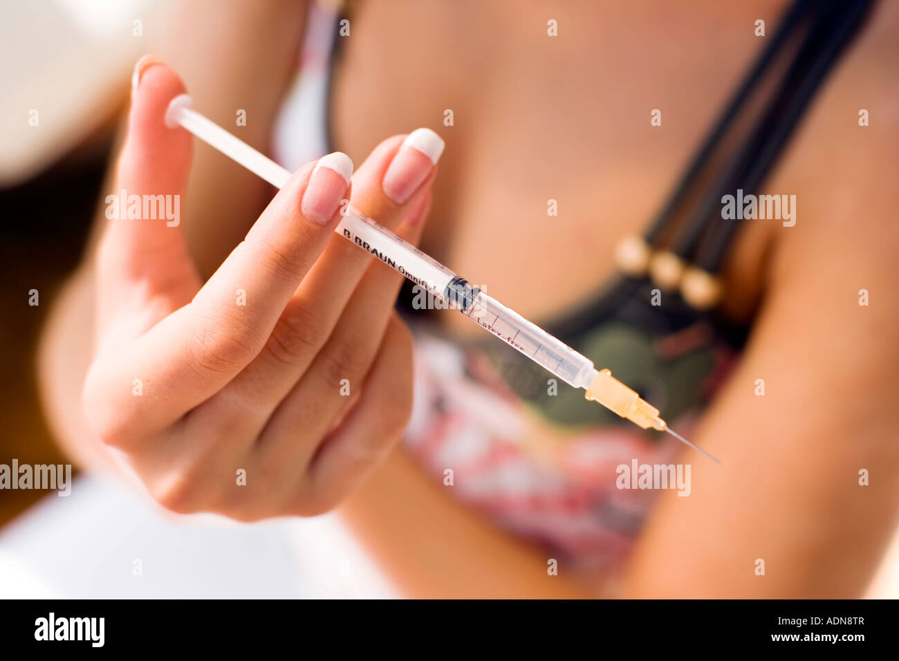 Woman about to use Insulin injection Stock Photo