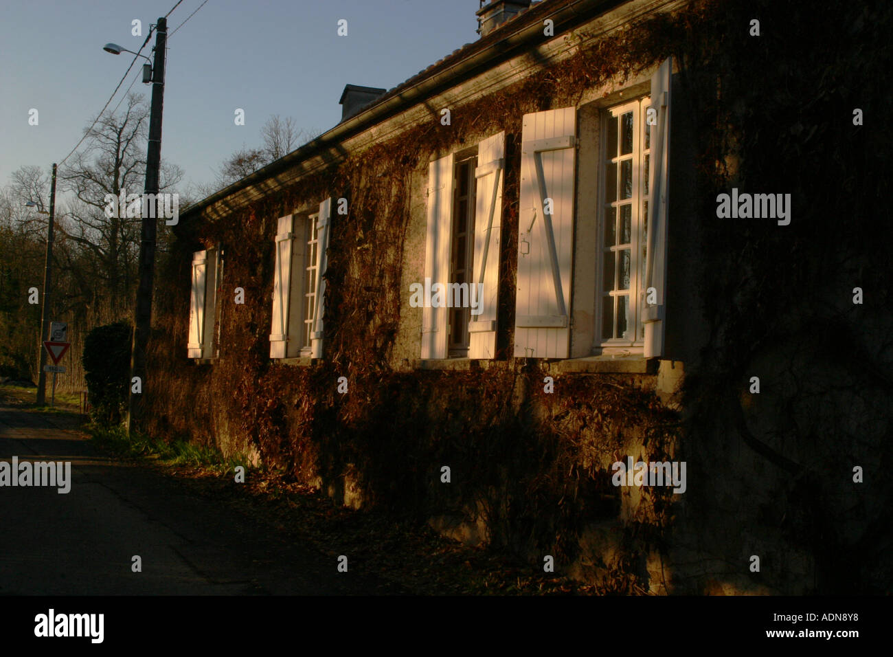 Evening sunlight on french house in country Stock Photo