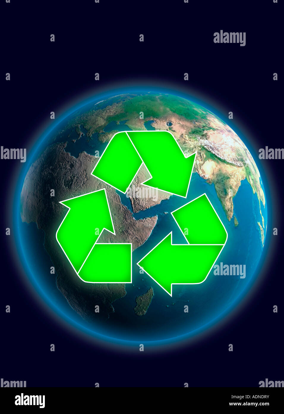 Recycling symbol over Earth globe Stock Photo