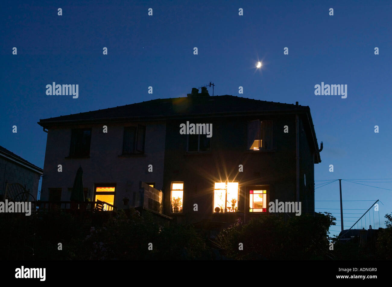 semi detached house and moon, Ambleside, Cumbria, UK Stock Photo