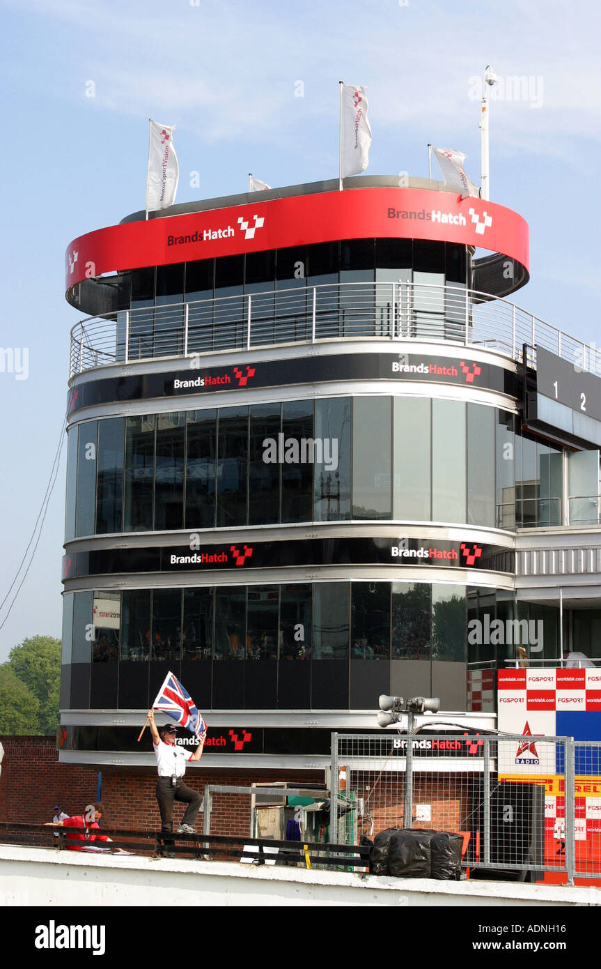 chequered flag being waved to signal finish at Brands Hatch Racing ...
