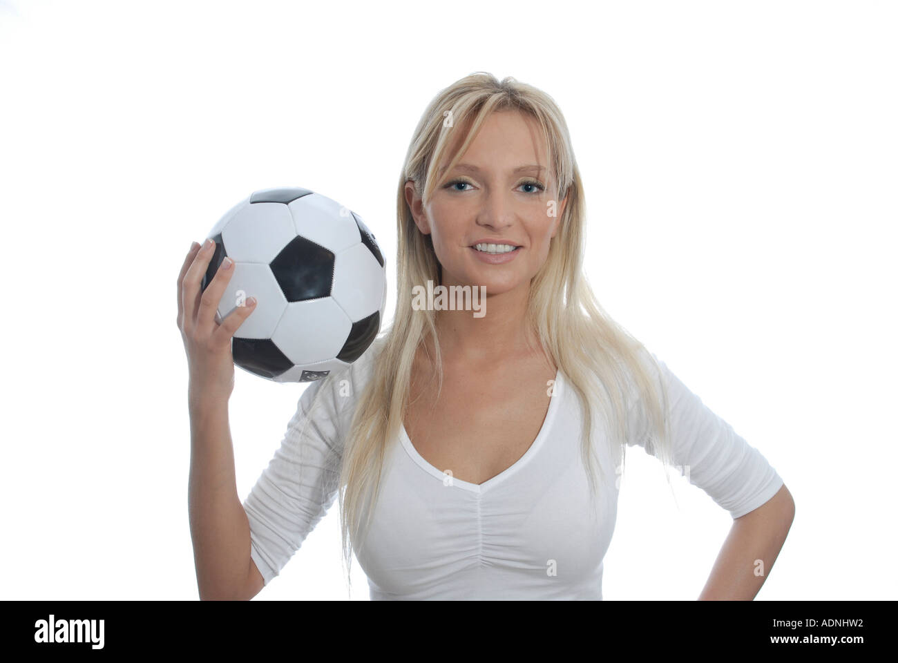 junge Frau blond freundlich laechelt Pose Fussball Stock Photo