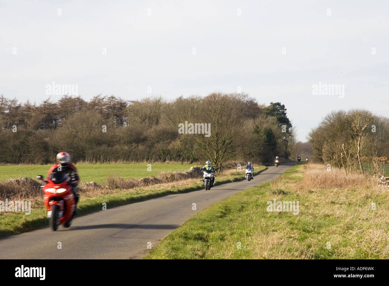 Motorcyclists on country road Shipton Under Wychwood Gloucestershire United Kingdom Stock Photo