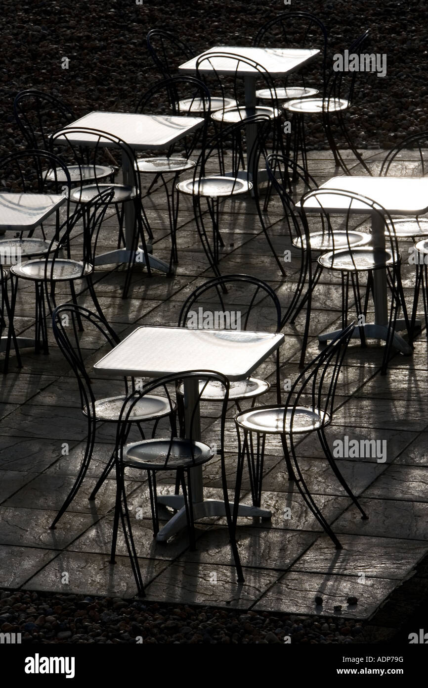 Deserted tables and chairs out of season on Brighton beach South Coast England United Kingdom Stock Photo