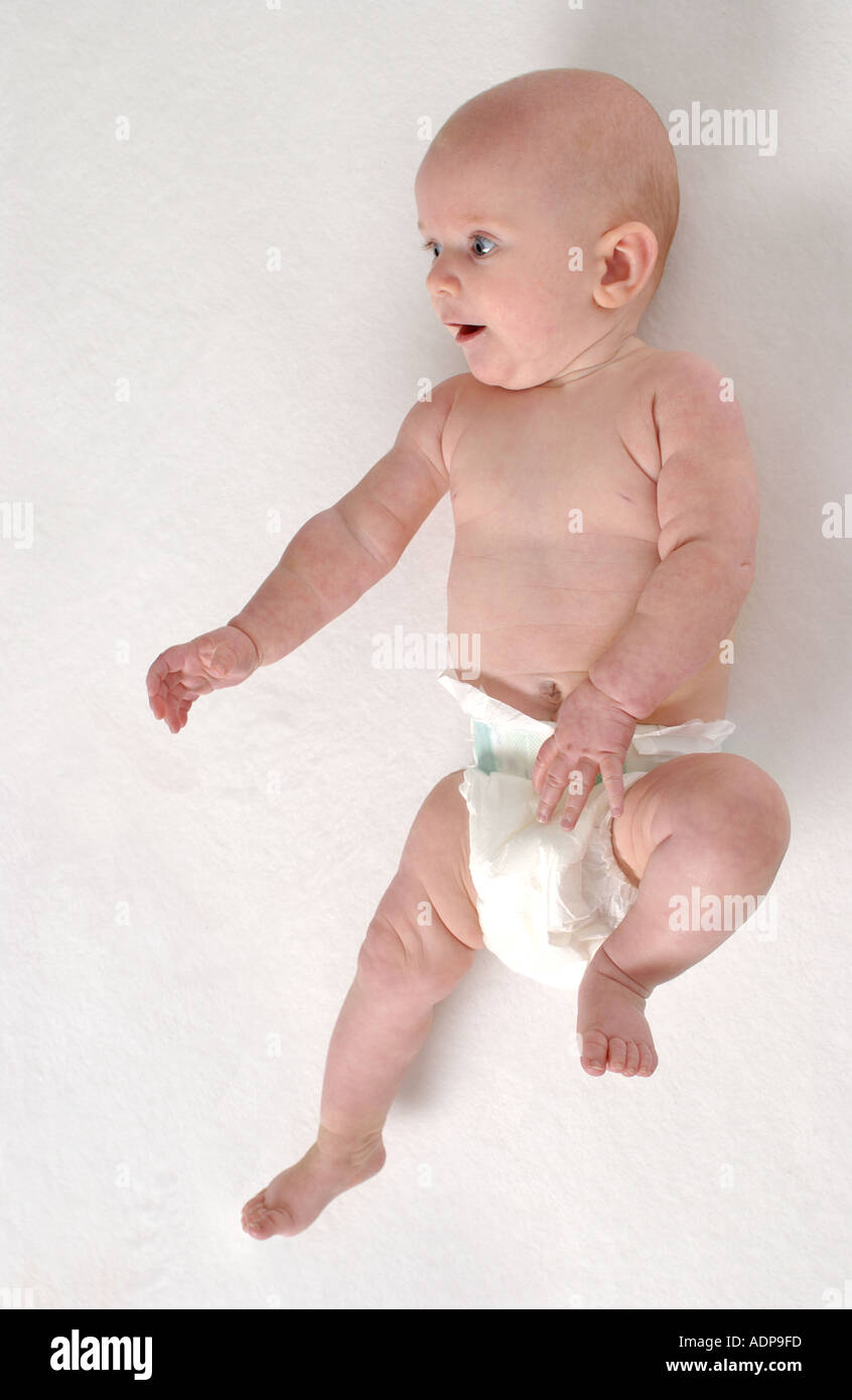 Baby lies full lenght on the floor Stock Photo Alamy