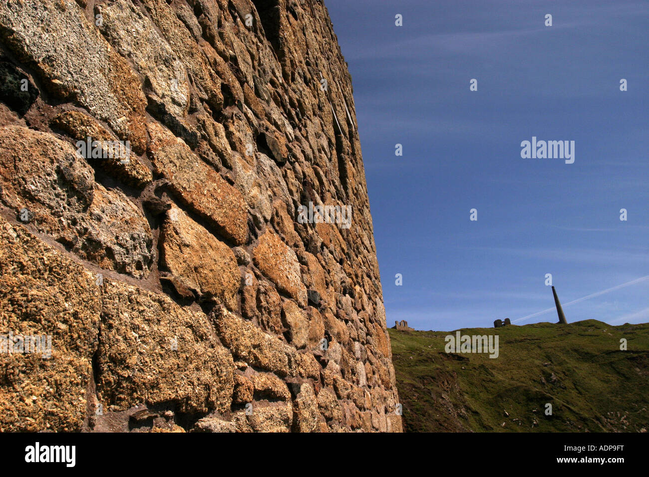 Granite walling with view of Levant Mine Cornwall UK Stock Photo