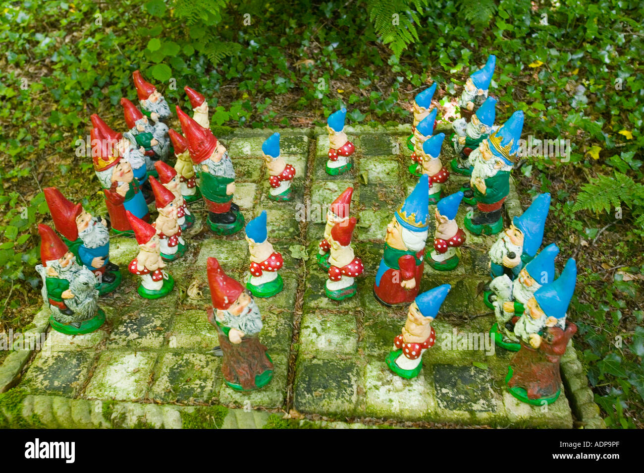 Gnomes playing chess at theWest Putnam gnome reserve, Devon, UK Stock Photo