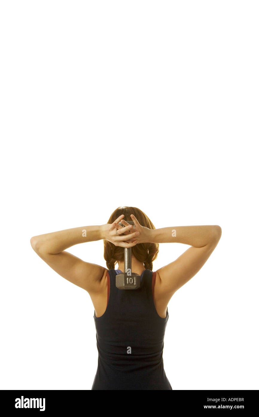 Woman holding a dumbbell Stock Photo