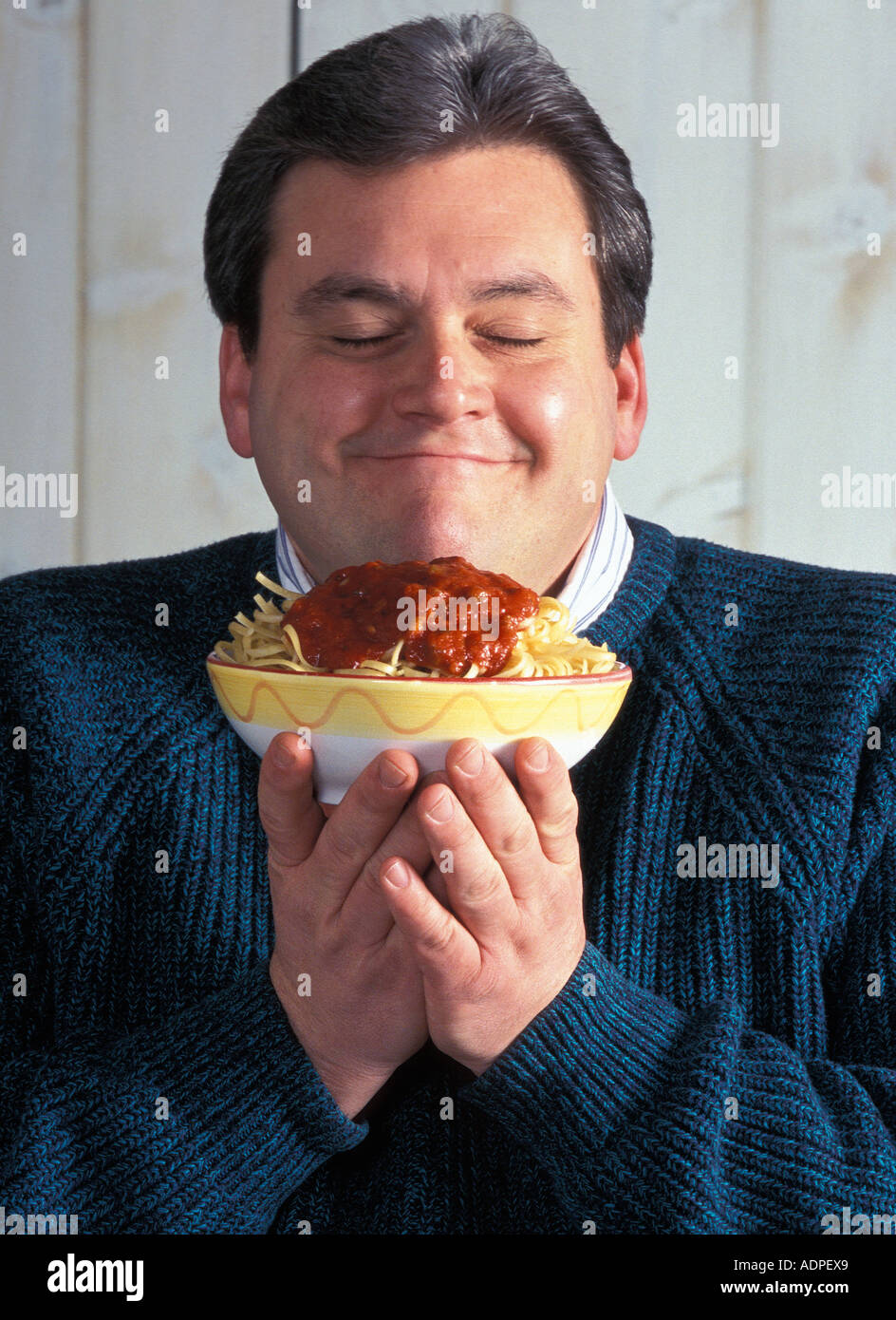 portrait of a man on a diet with bowl of pasta Stock Photo