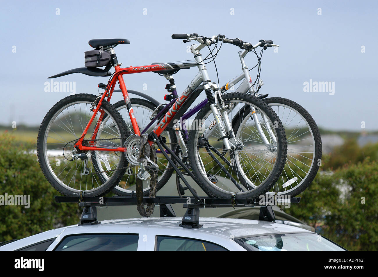 bikes on top of a car roof rack in 