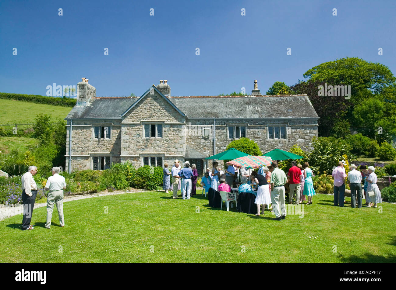 a family garden party outside an ancient Cornish farmhouse, St Neots