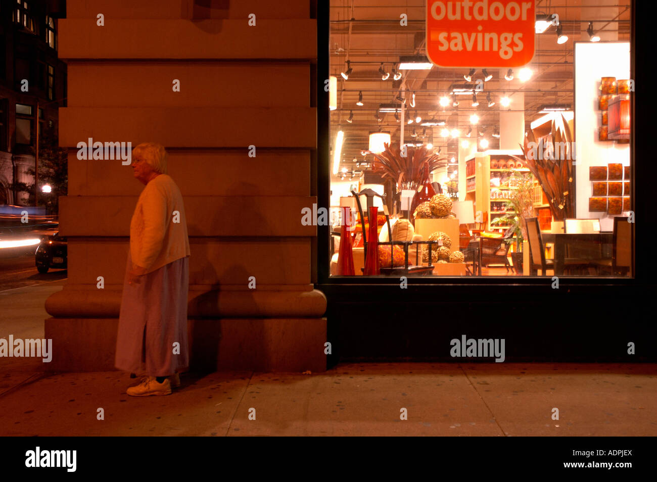 Old lady outside furniture store, manhattan Stock Photo Alamy