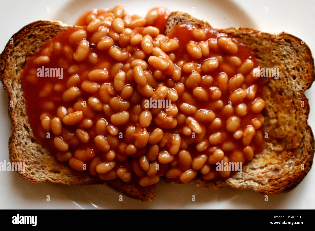 Baked beans on Toast on a white plate Stock Photo Alamy