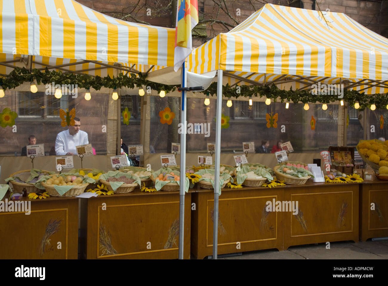 French Market stall under white yellow canopies displaying natural soap  products for sale Chester Cheshire England UK Stock Photo - Alamy