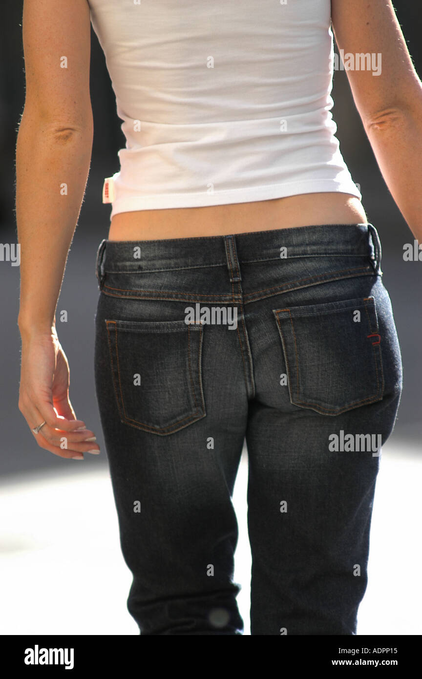 Woman with tight blue jeans with midriff showing in French Quarter New  Orleans Louisiana Stock Photo - Alamy