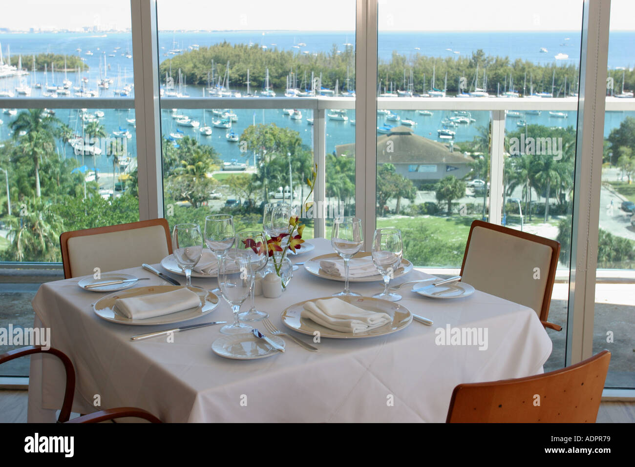 Florida Miami Coconut Grove Sonesta hotel Panorama restaurant Biscayne Bay water view dining table Stock Photo