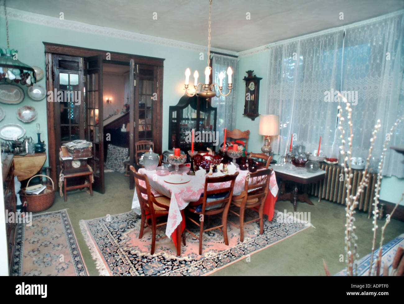 Investments Interior Home Antiques  Dining Room, Single Family House' Table Full Carpet Christmas Home USA, vintage Christmas Stock Photo