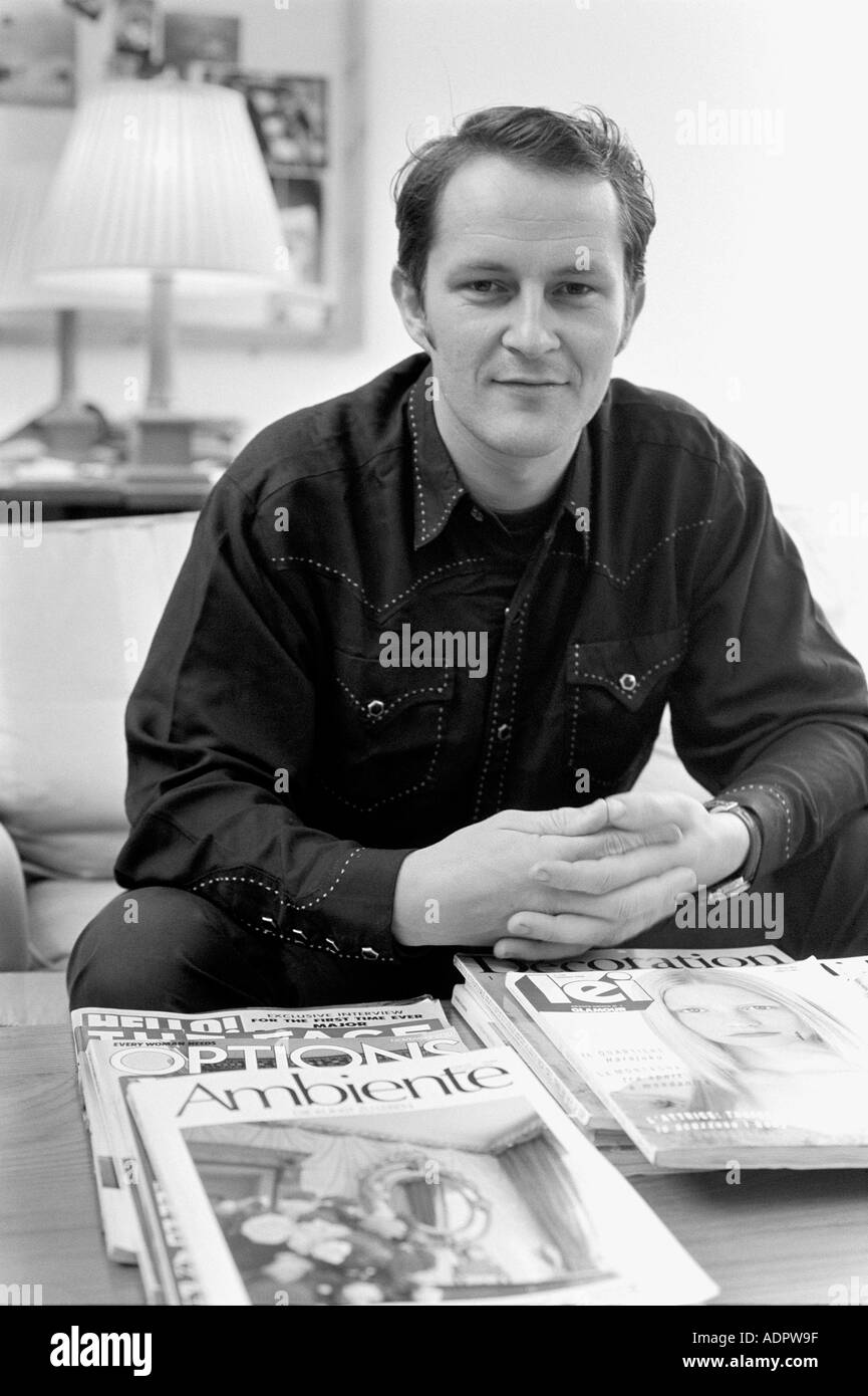 Nick Ashley Fashion Designer sitting in his office in London, UK Stock  Photo - Alamy