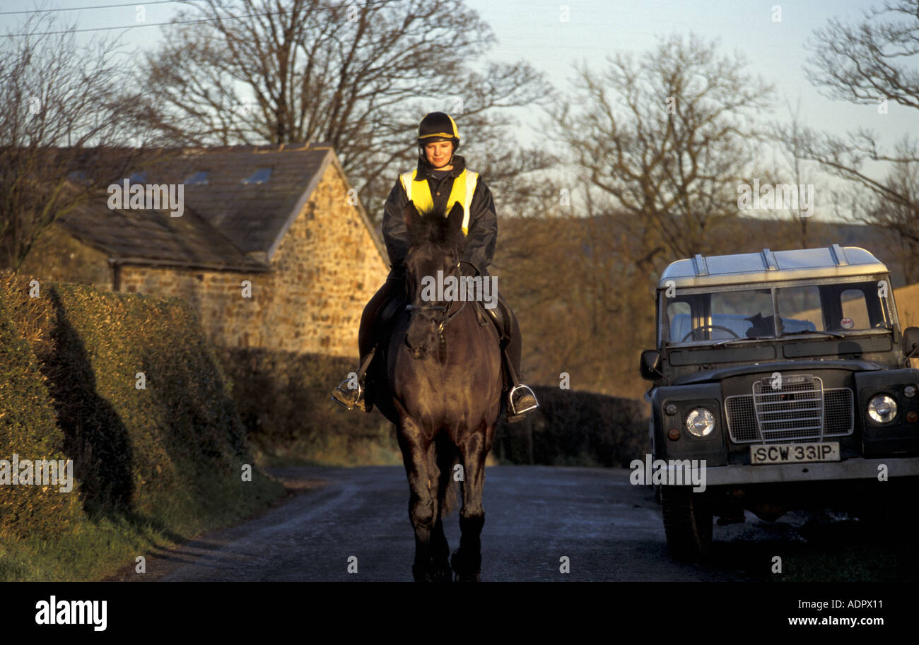 Horse rider in quiet lane in Forest of Bowland Lancashire england Stock