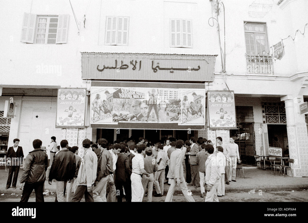 Street scene of Moroccan people outside a cinema in Meknes in Morocco