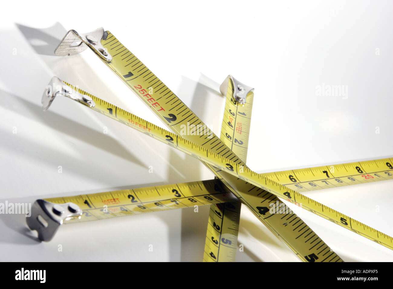 Yellow Steel Tape Measures Criss Crossed Feet Inches Centimetres Metres Yellow Steel Tape Measures Criss Crossed Feet Inches Centimetres Metres