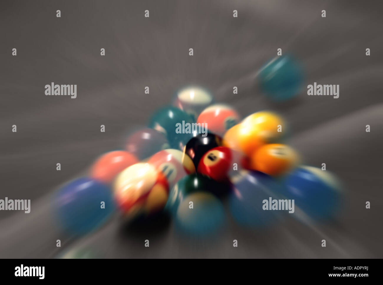 A zoomed and blurred image of a pool ball break filled with movement