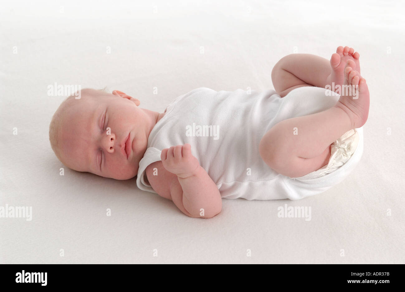 Sleeping baby on the floor Stock Photo