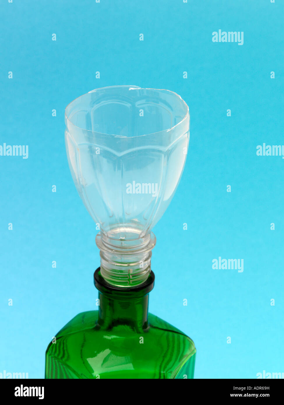 Funnel made from Plastic Bottle and green Glass Bottle Stock Photo