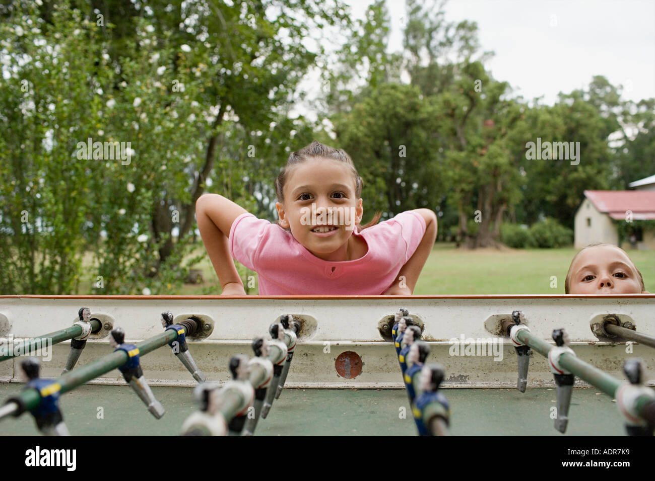 Girl playing table football Stock Photo - Alamy