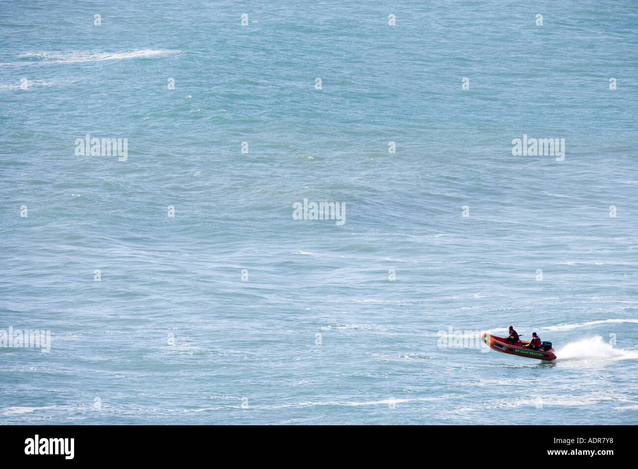 New Zealand North Island Muriwai Beach Surf Lifesavers ride in Zodiac