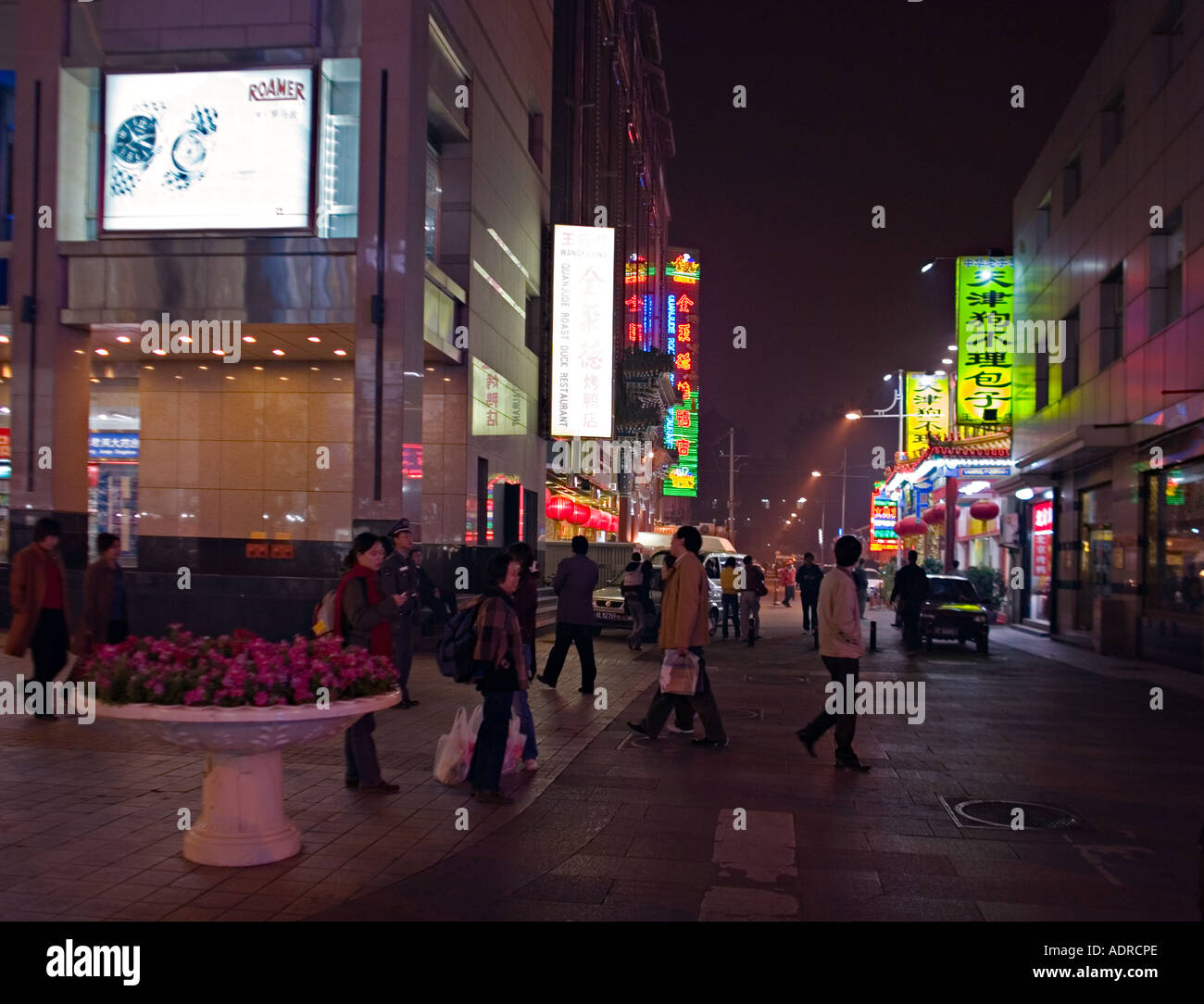 CHINA BEIJING Night scene of neon lights and busy street in downtown ...