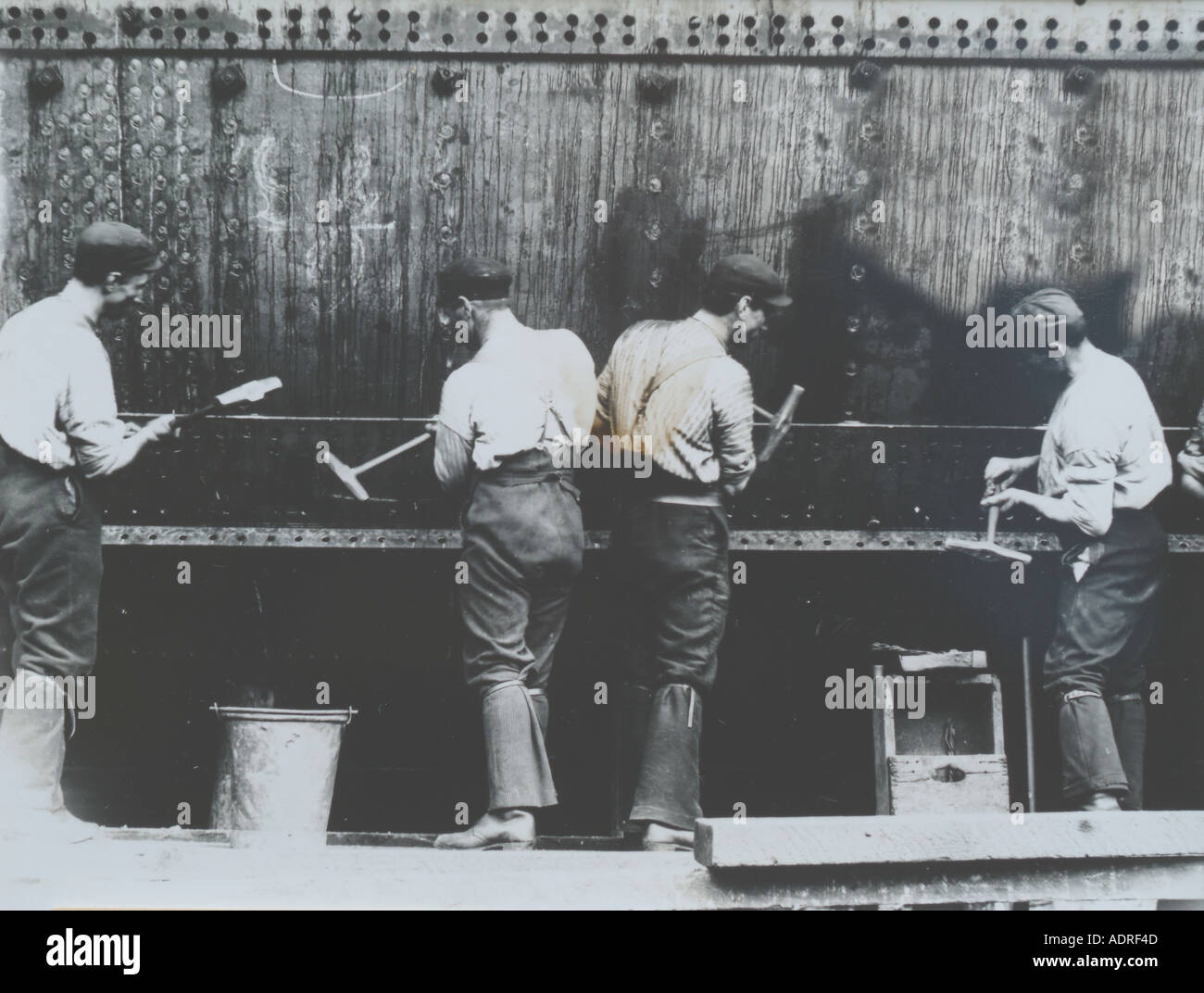 UK Scotland Greenock 1890 s shipyard building the SS Isis Riviting the hull plates Stock Photo