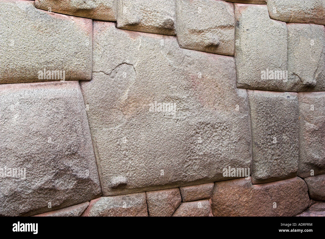 Famous 12 sided stone in wall of [Palace of Inca Roca], [Calle Hatunrumiyoc], Cusco (Cuzco), Peru, 'South America', 'close up' Stock Photo