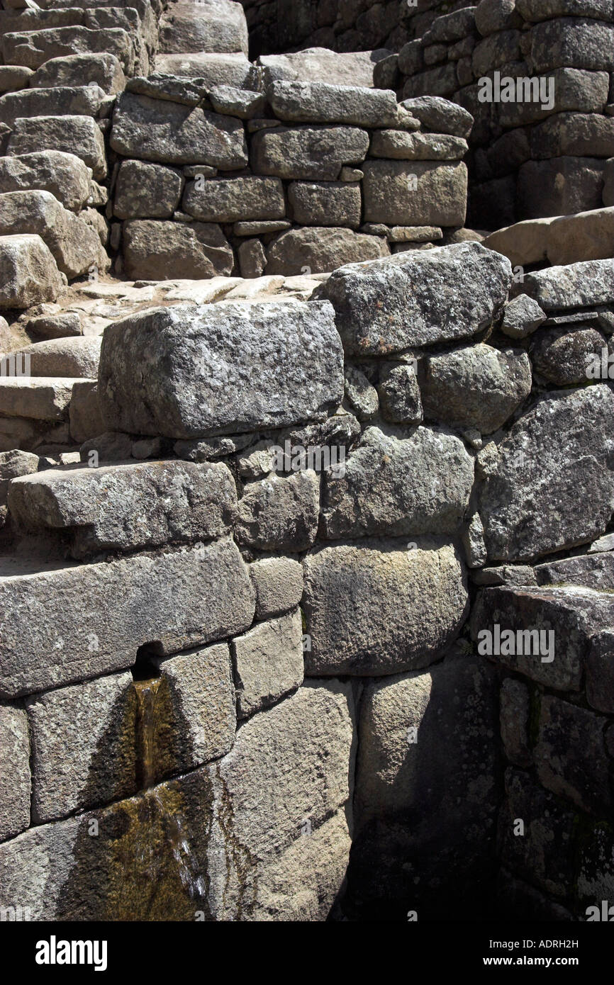 Inca fountain, ancient water system, [Machu Picchu], Peru, "South