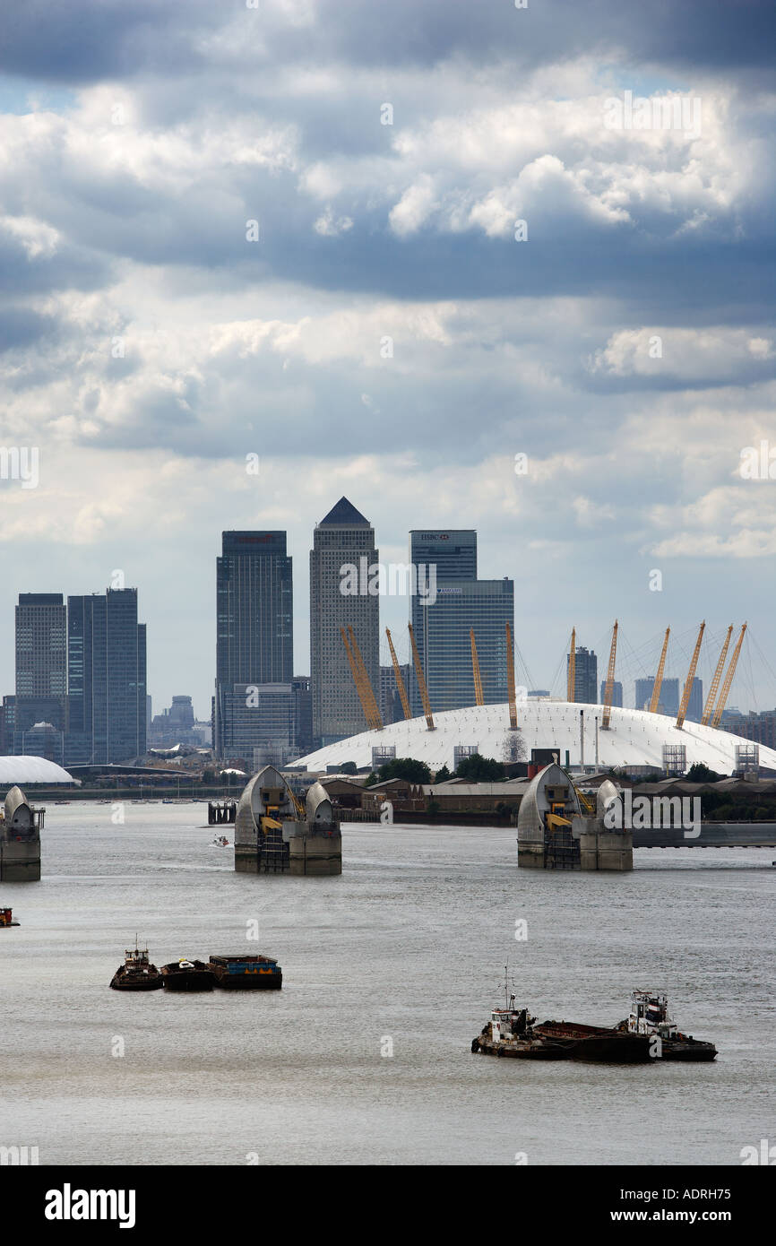 Skyline of Canary Warf with the Millenium Dome river Thames and Thames Barrier in the forground Viewed from Woolwich Stock Photo