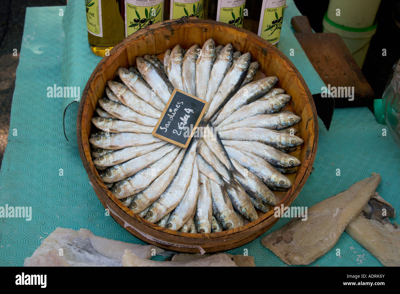 Sardines for sale displayed on a barrel at a fish market in the Herault