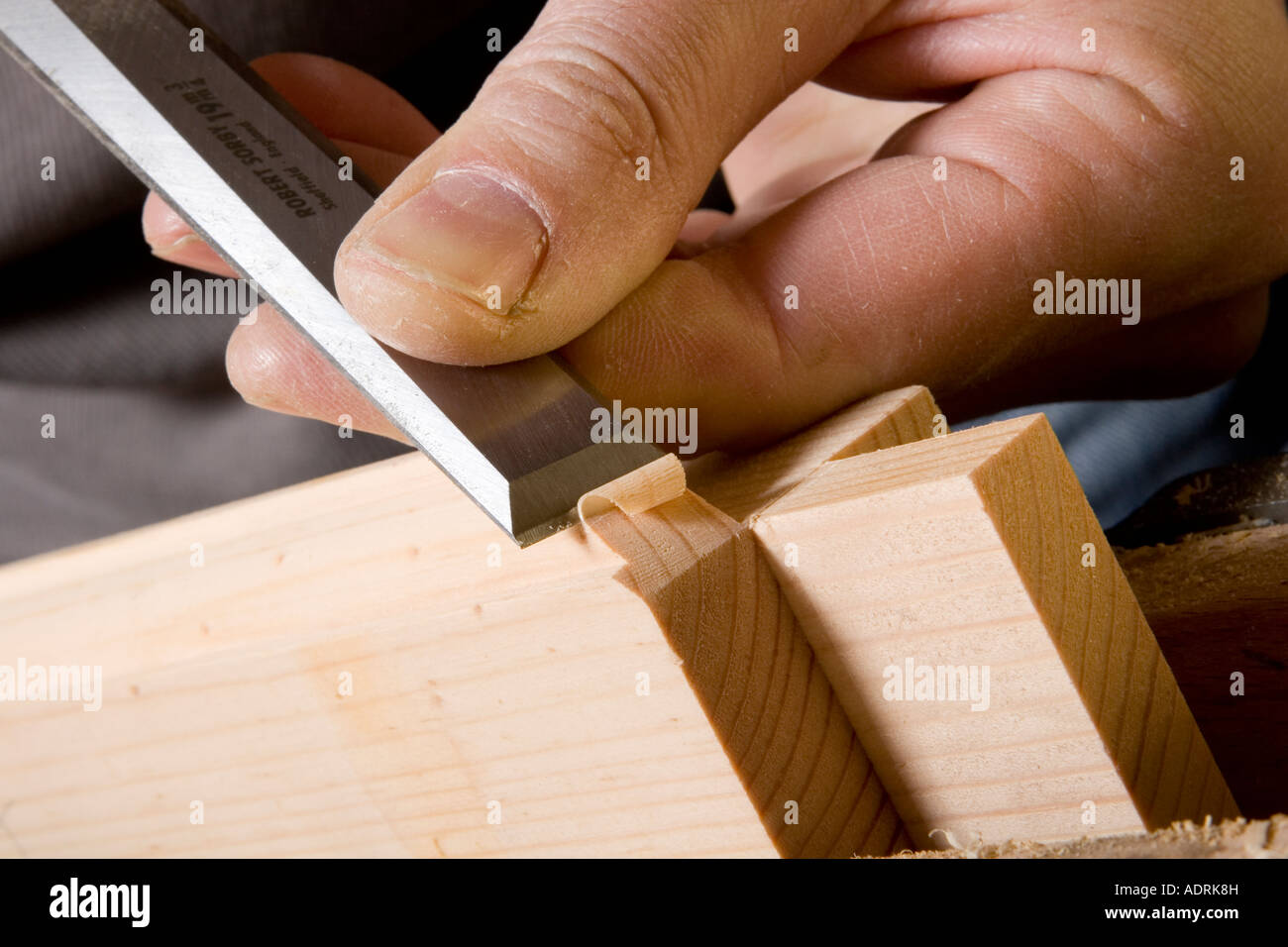 Close up of a carpenter using a chisel to make a joint Stock Photo Alamy
