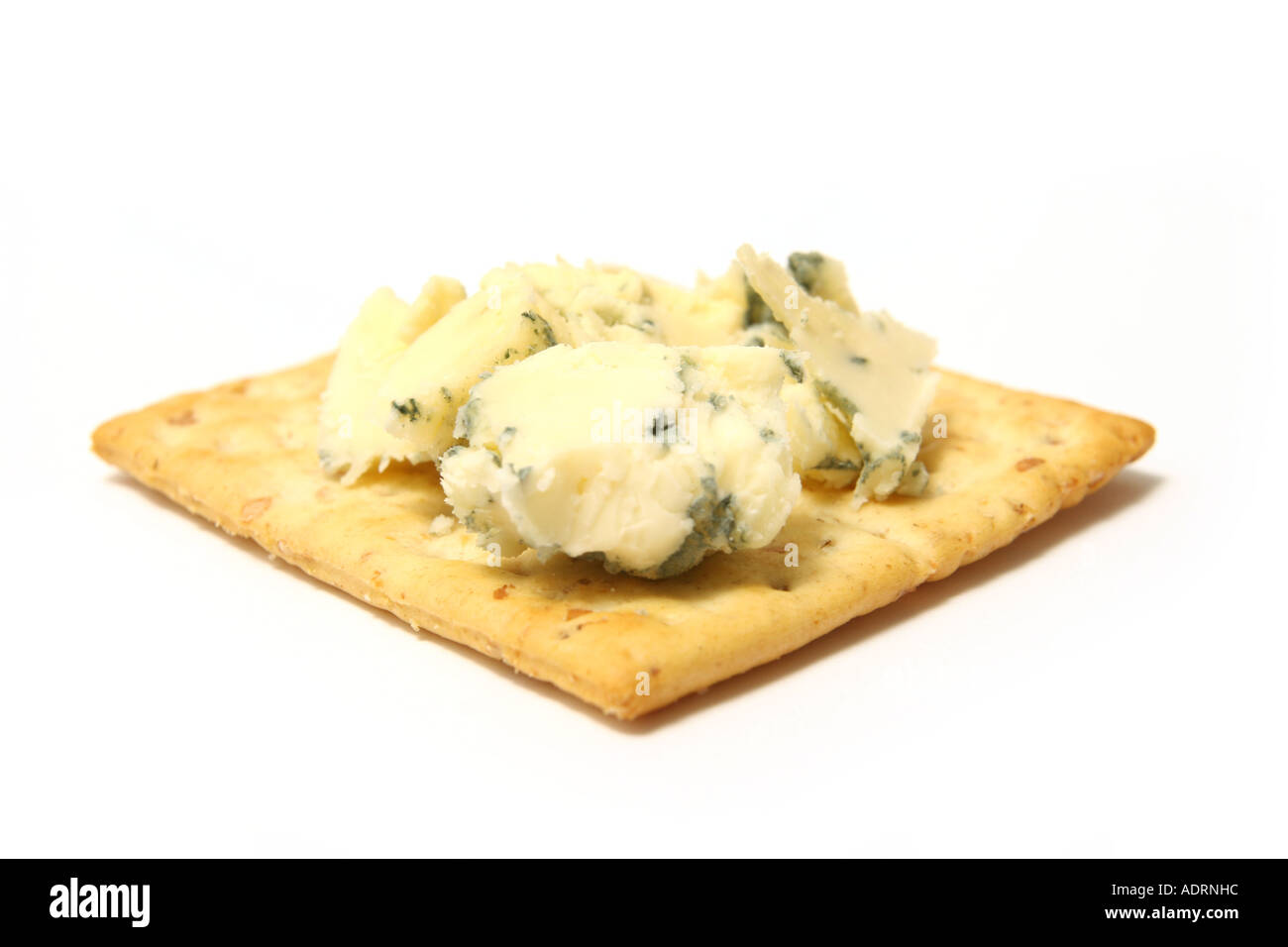 Stilton Shortbread Stilton cheese on a biscuit, Shot on a white studio background Stock ...