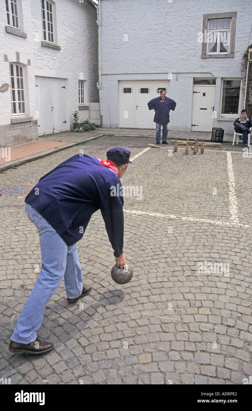 Playing skittles in the street as recreation of traditional games Han sur Lesse Belgium Stock Photo