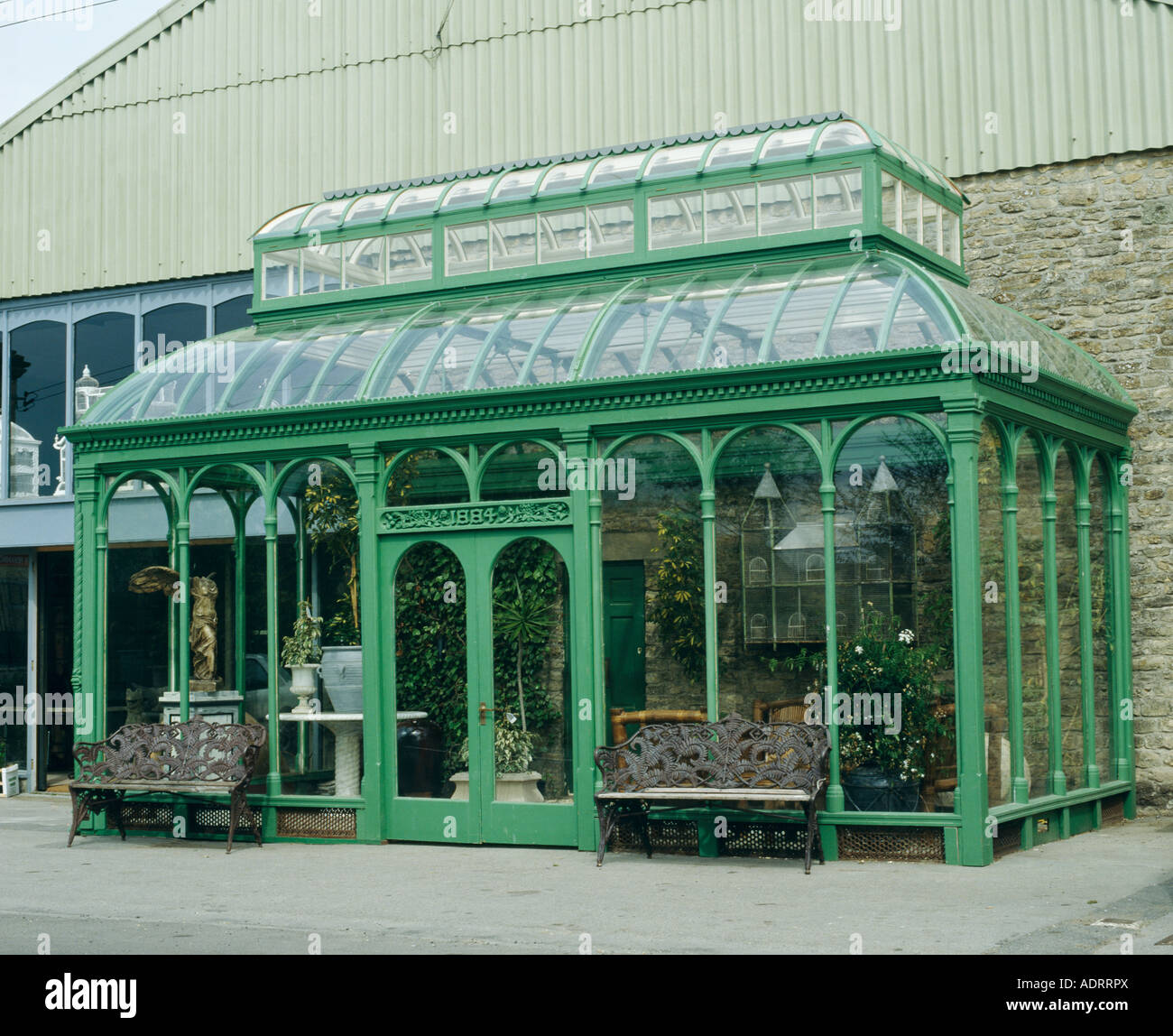 Large Victorian glass conservatory painted green Stock Photo - Alamy