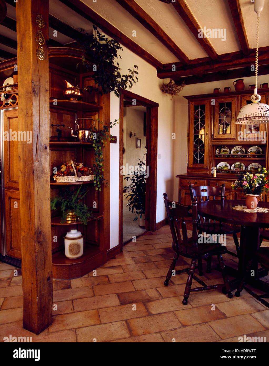 Large Upright Wooden Supporting Beam In Diningroom With Corner