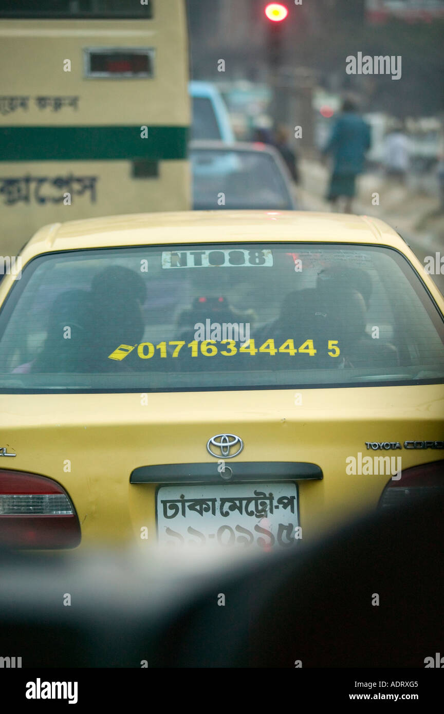 A taxi cab in Dhaka Bangladesh advertising contact mobile phone number