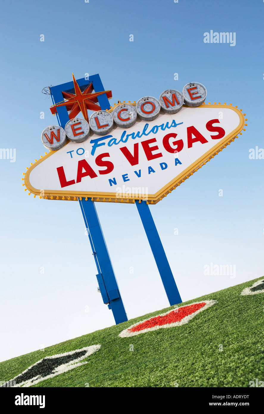 Welcome to Las Vegas sign with playing card suits in grass Stock Photo