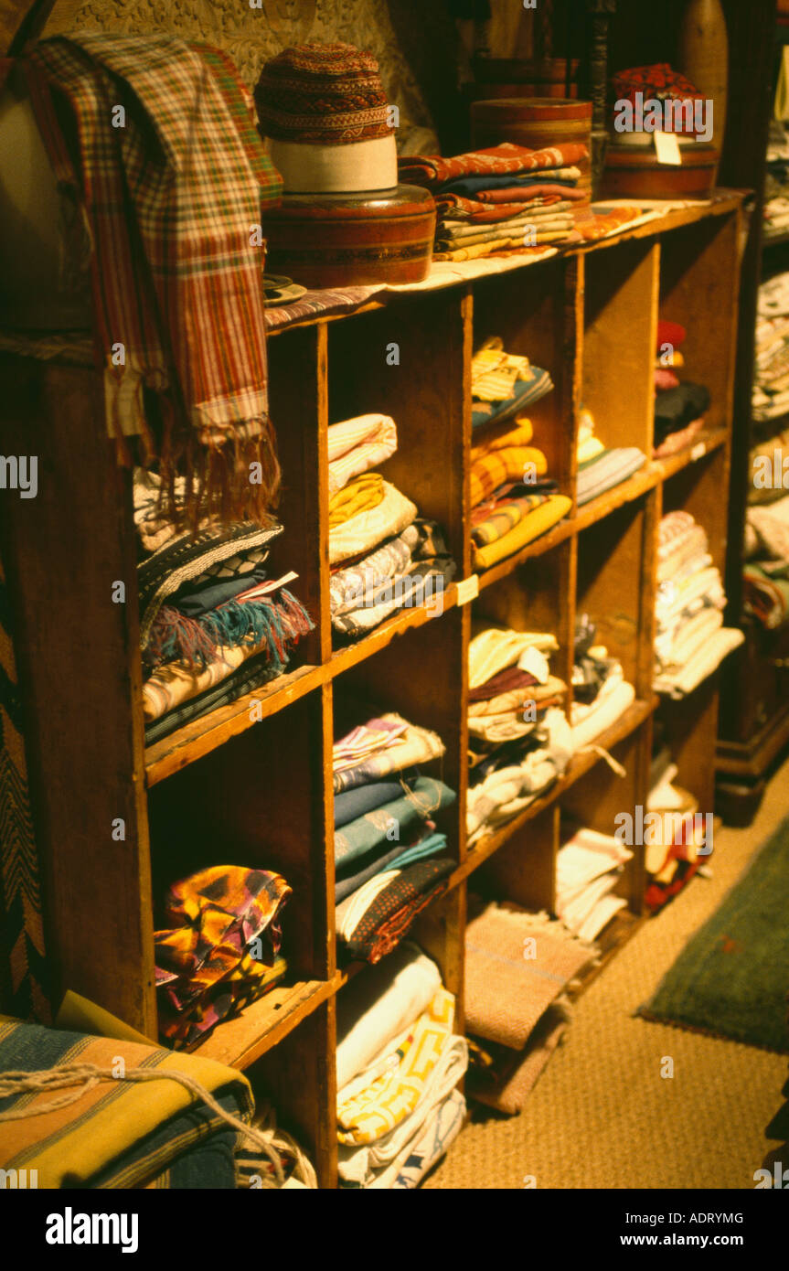Vintage clothes on shelves in Joss Grahams shop Stock Photo