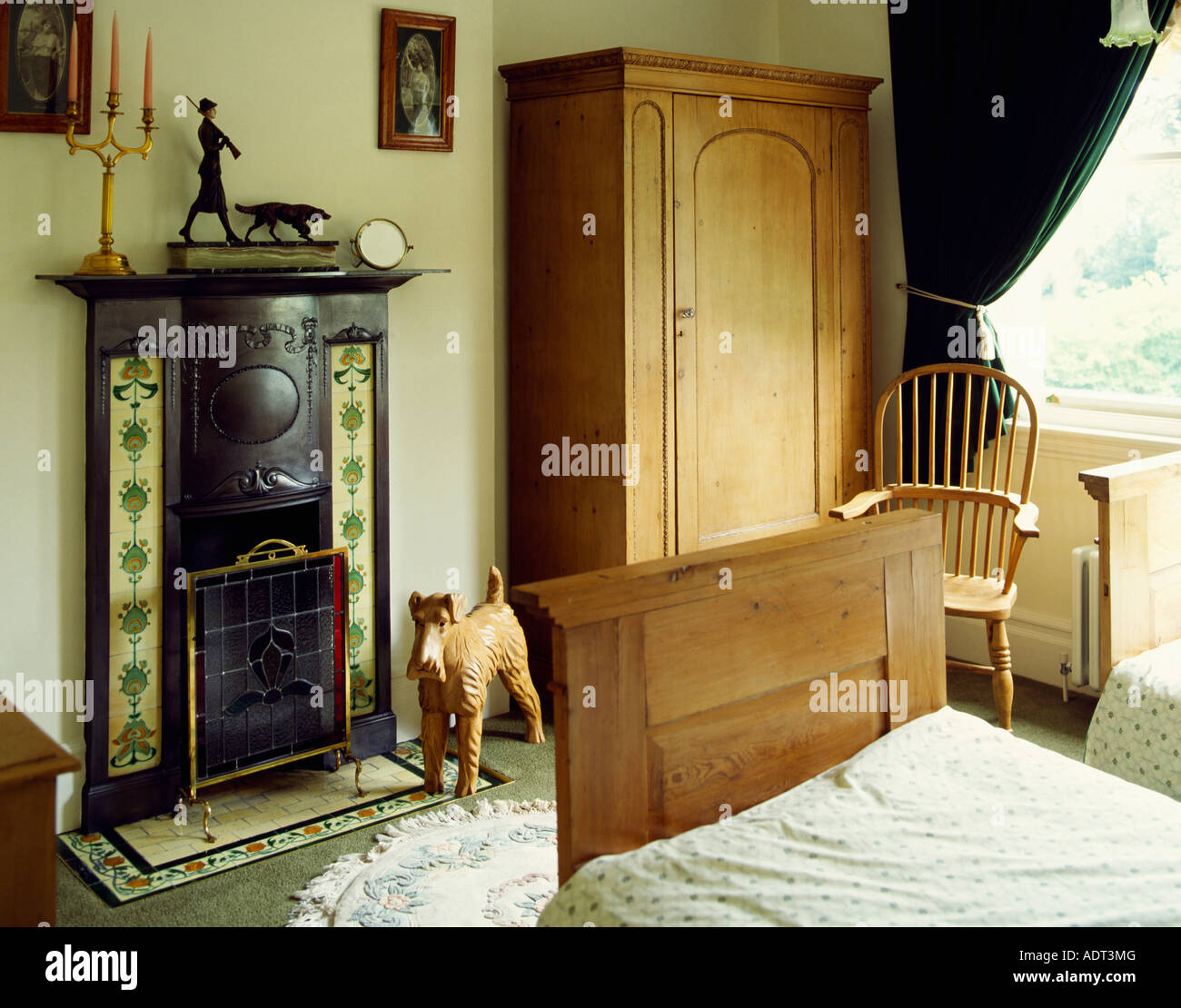 Pine Wood Wardrobe And Bed In Bedroom With Small Cast Iron
