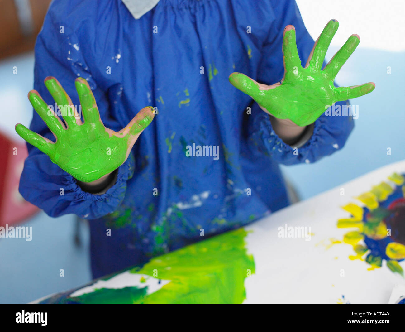 Boy finger painting in art class, mid section Stock Photo Alamy