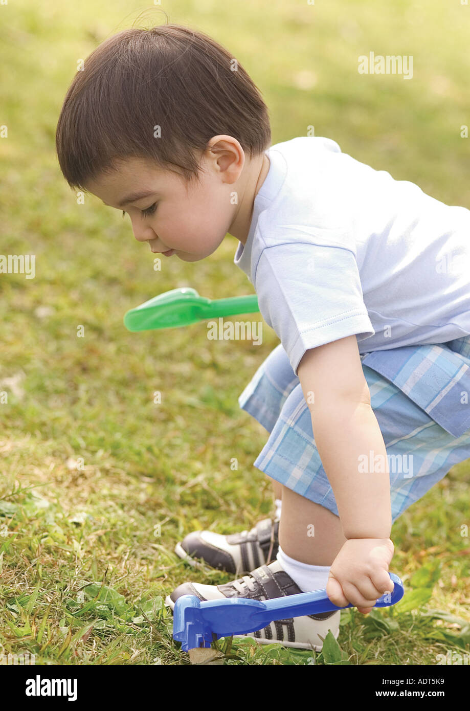 Child holding rake hi-res stock photography and images - Alamy