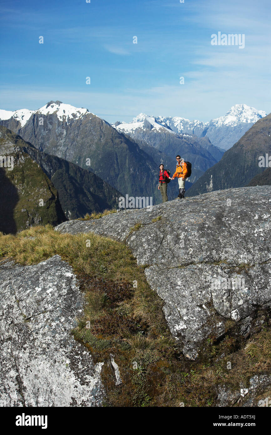 Two hikers in mountains Stock Photo - Alamy