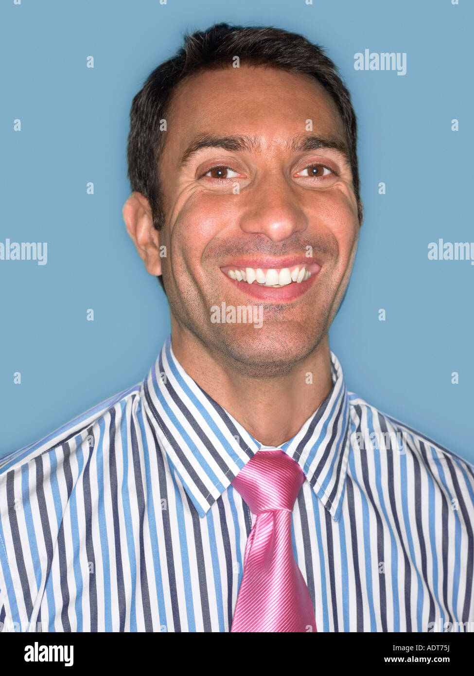 Man in shirt and tie, smiling,