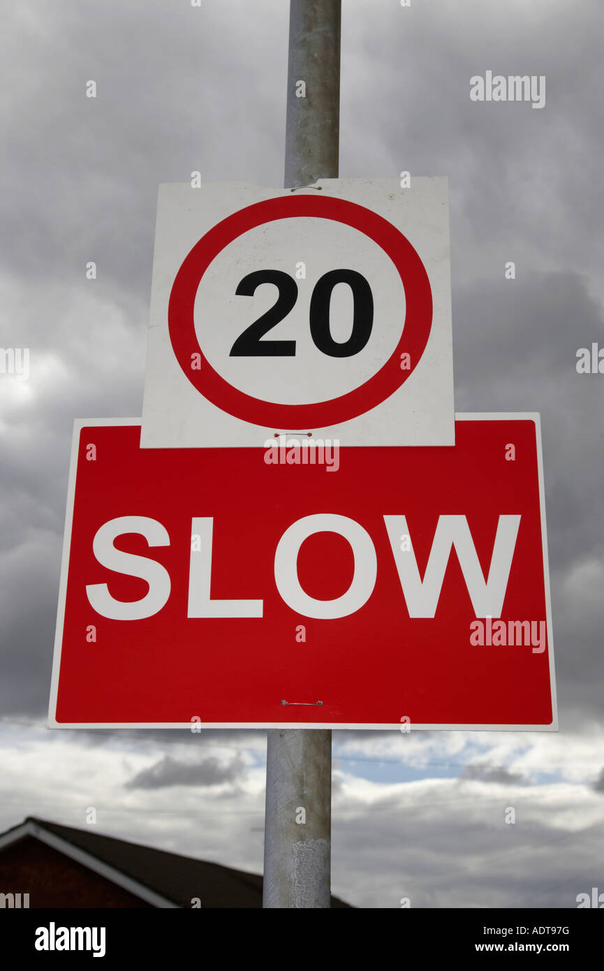 temporary 20mph and red slow signs posted in residential area due to traffic diversion Stock Photo